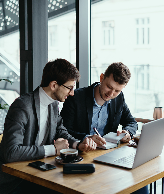 two young businessman having successful meeting restaurant 1