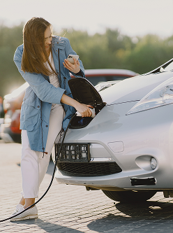 woman charging electro car electric gas station 1